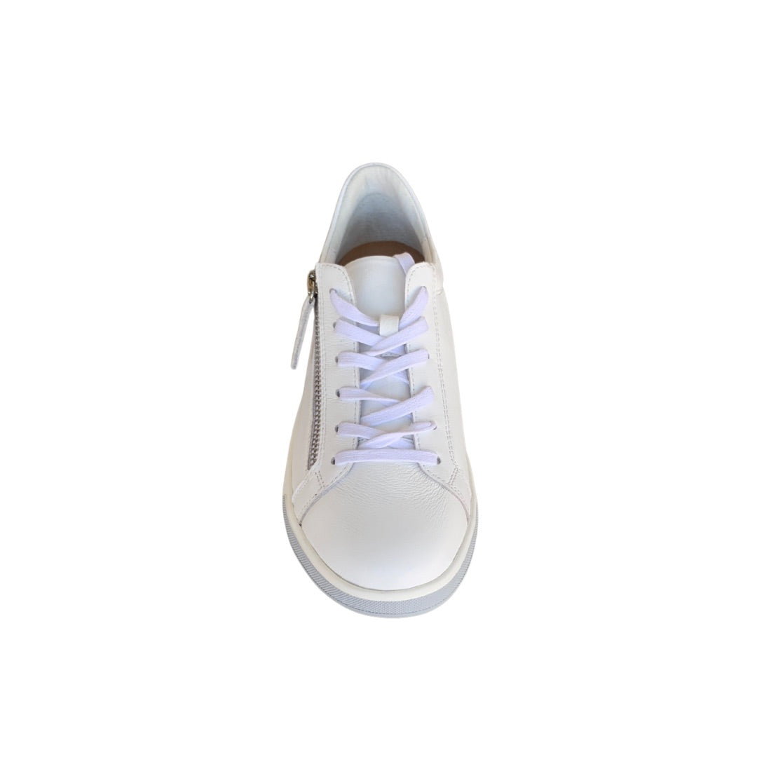 Front view of women’s white zip up sneaker